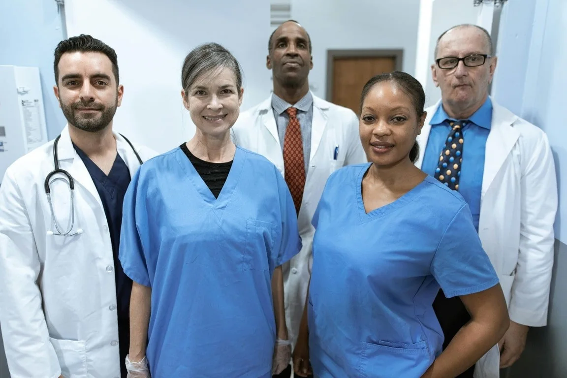 A diverse group of healthcare professionals standing together